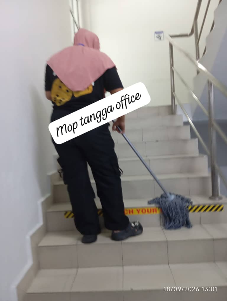 Cleaner maintaining an office staircase