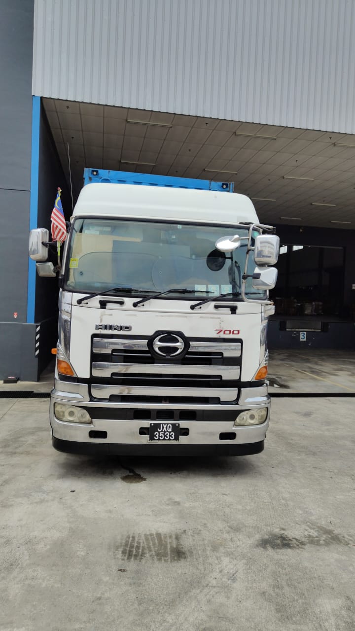 Logistics truck arriving at a warehouse site